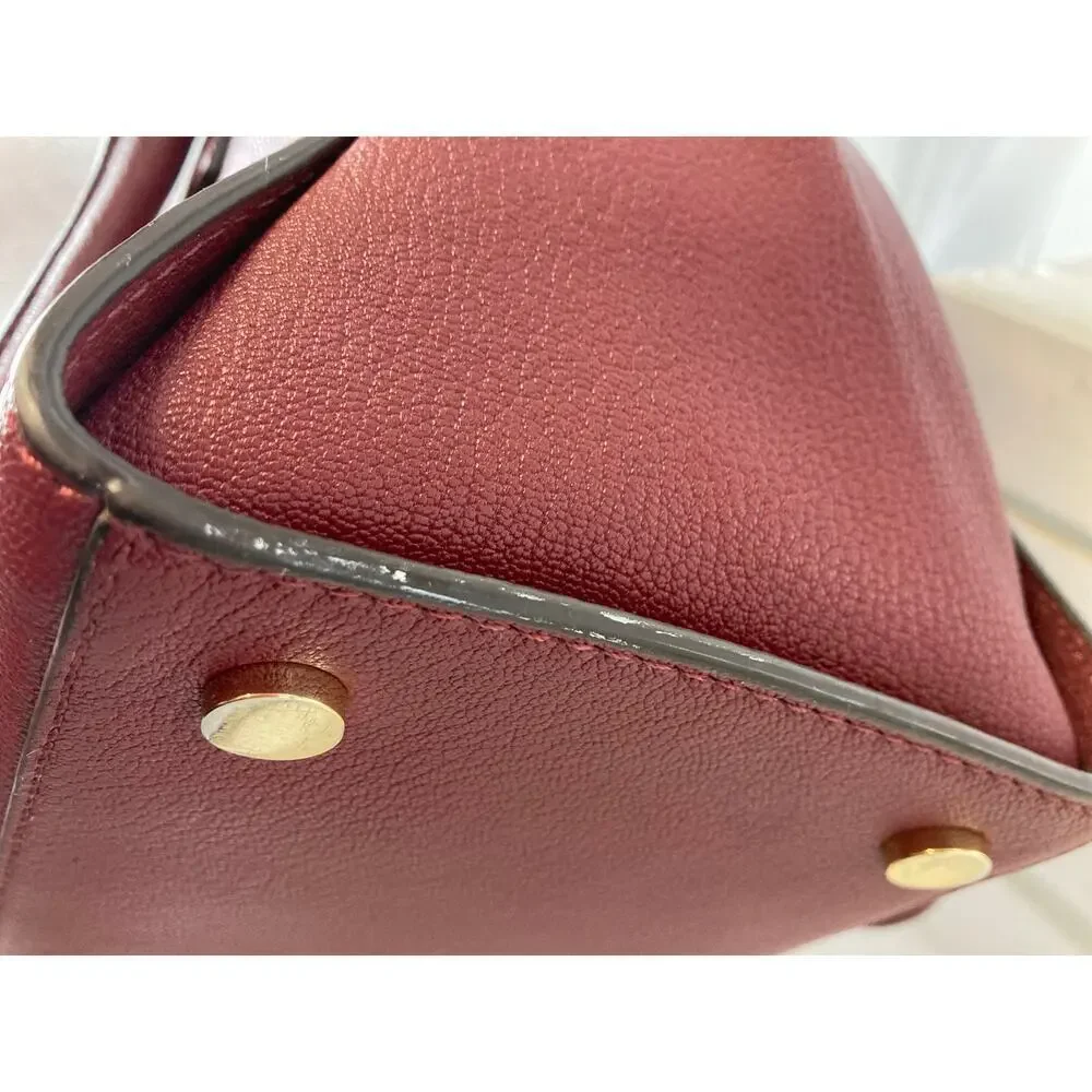 MICHAEL KORS, LARGE WINE LEATHER HANDBAG WITH LOCK CHARM.
